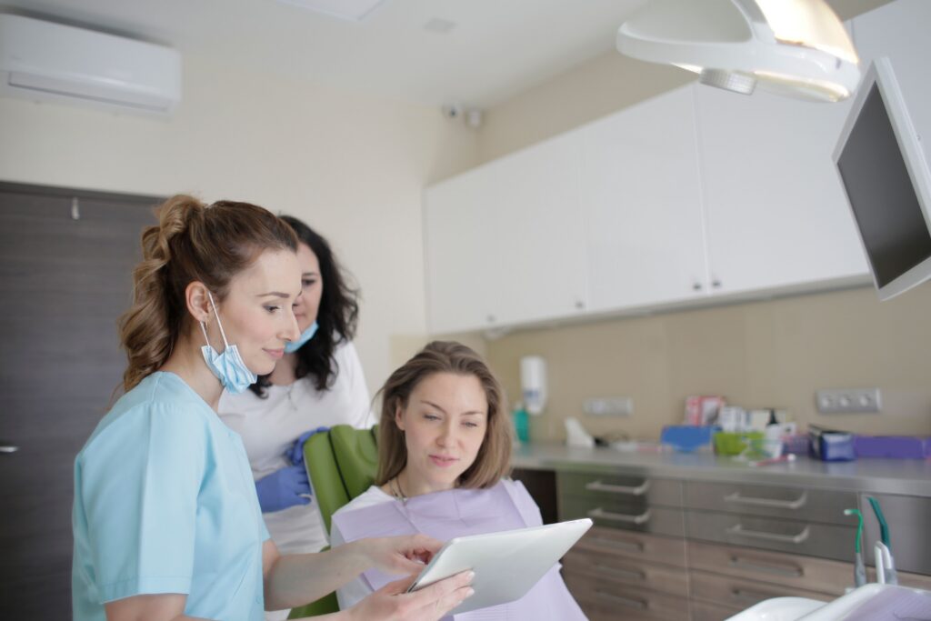 Dentist reviewing a personalized treatment plan with a patient during a routine dental consultation in a modern family dental office.